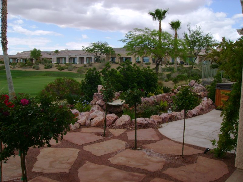 Las Vegas Landscape with water feature, flagstone, palms on golf ...