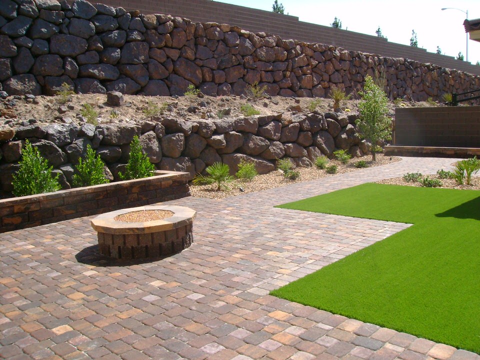 backyard with paving and grass
