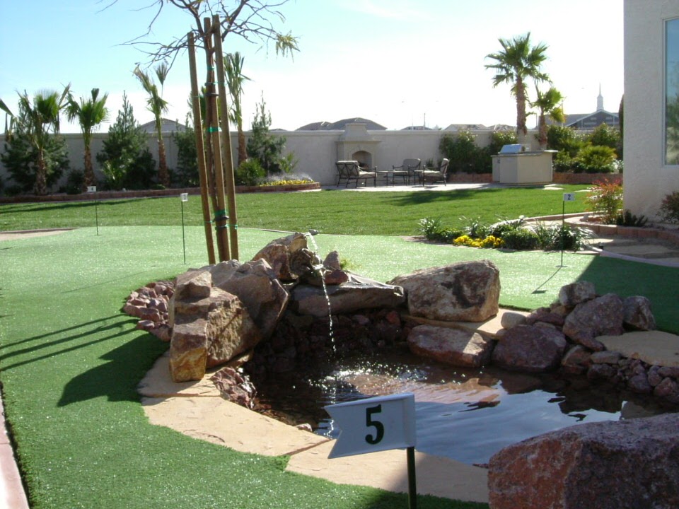 Las Vegas backyard with grass and a pond